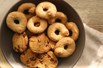 Plate of sugar cookies and chocolate chip cookies on the table. Flat lay.