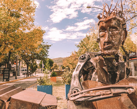 iron statue with trees in the background. mountain town La Falda, Cordoba, Argentina