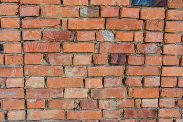 Red brick wall texture grunge background with vignetted corners to interior design