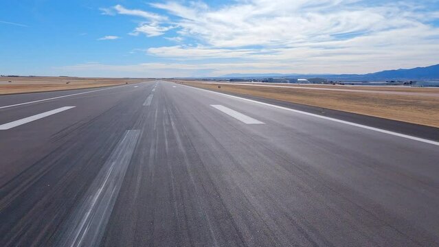 Airplane view taking off from the Colorado Springs Airport runway to the south