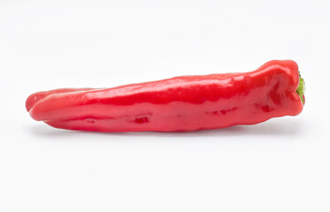 a single red pepper on a white background - 497095204