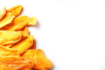 Dried mango sliced on a white background with free space