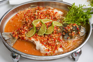 A Spicy Sea Bass with Chopped Peppers in Thai Sauce