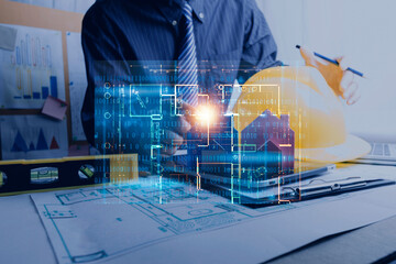 engineer people meeting working and pointing at a drawings in office for discussing. Engineering tools and construction concept.