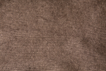 Close up texture of knitted brown fabric cloth