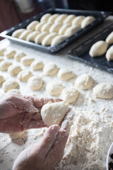 Woman cooking pies at home. Cooking and baking at home.