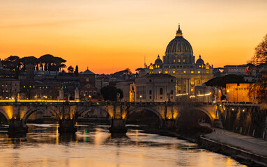 Fototapeta na wymiar St. Angelo Bridge and St. Peter's Basilica at Sunset