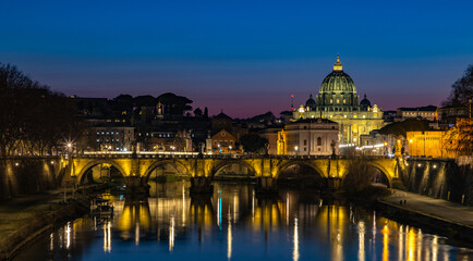 Fototapeta na wymiar St. Angelo Bridge and St. Peter's Basilica at Night