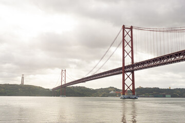 25th of April bridge and Christ the King statue, in Lisbon - Portugal