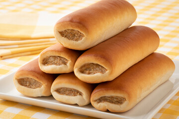 Heap of Brabantian fresh baked sausage rolls close up for a snack   
