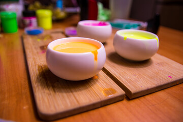 palette with blue, red, pink paint on a wooden base