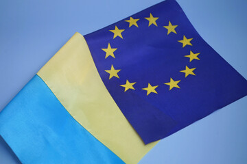 flags of the european union and ukraine together, support by the european union of ukrainians, concept ukraine is a candidate member of the european union
