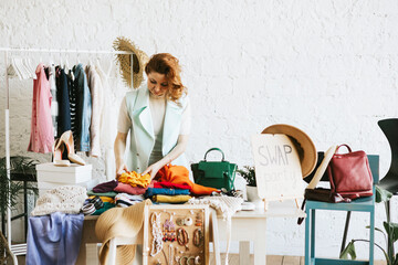 middle aged woman female woman at swap party try on clothes, bags, shoes and accessories, change clothes, second hand garment, zero waste life, eco-friendly approach to consumption, diverse people