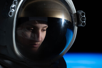 CU Portrait of Caucasian female astronaut during spacewalk