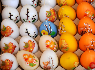  Paraffin decorative candles in the shape of colorful Easter eggs.