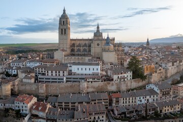 Segovia Cathedral aerial panorama view at sunrise in Spain. View over the town with its cathedral and medieval walls. Beautiful sunny day. Unesco world heritage site.