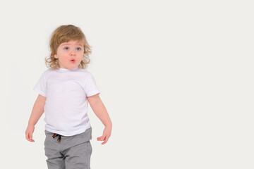 Surprised child on a white background. Copy space. High quality photo