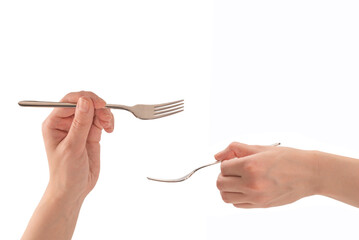 Fork in woman hand isolated on white.