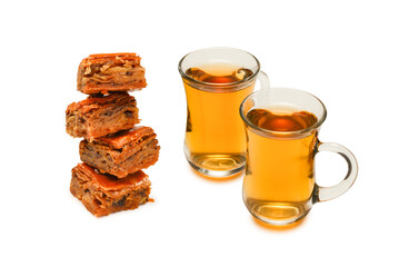 Turkish sweet baklava with turkish tea isolated on white background. .