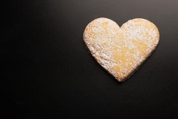 Shortbread in the shape of a heart isolated on white background.