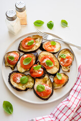 Baked eggplant with tomato, cheese and basil