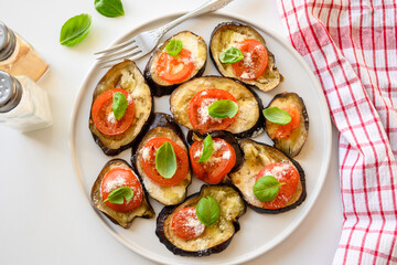 Baked eggplant with tomato, cheese and basil