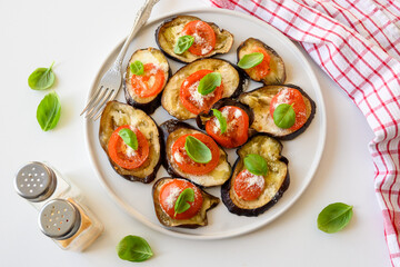 Baked eggplant with tomato, cheese and basil