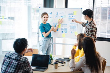 Successful business people present analytics reports while working with colleagues in the modern office.