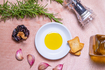 Obraz na płótnie Canvas Assorted Mediterranean olive oil, rosemary, garlic, rich and healthy seasonings