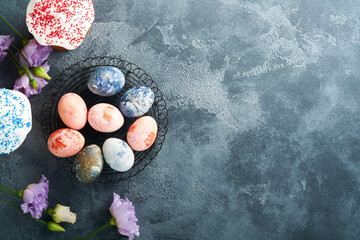 Easter eggs. Dyed Easter eggs with marble stone effect ref and blue color in rustic style on dark ...