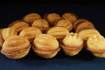 Pastry nuts with filling on the table in the kitchen