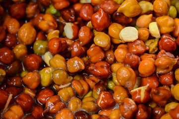 Closeup of brown chickpeas soaked in water