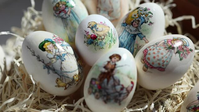 Lots of different drawings on goose eggs for Easter festival. Eggs on hay. Hand made print. Spring hollidays. Easter concept