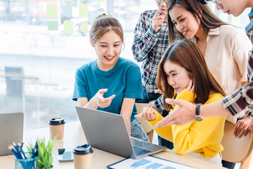 Successful business people present analytics reports while working with colleagues in the modern office.