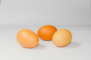 eggs isolated on a cutting board white background ,several eggs.