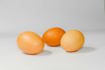 eggs isolated on a cutting board white background ,several eggs.