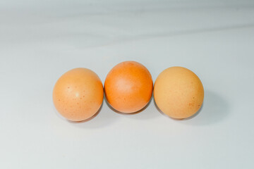 eggs isolated on a cutting board white background ,several eggs.