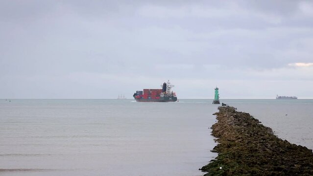 Container Ship Going Past Starboard Beacon and Tall Ship, River Liffey, County Dublin