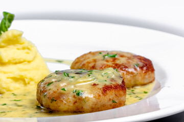 Cutlets with onion sauce and mashed potatoes