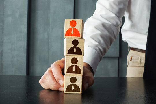 Unfair selection and career development and leadership are shown with wooden cubes and icons of employee