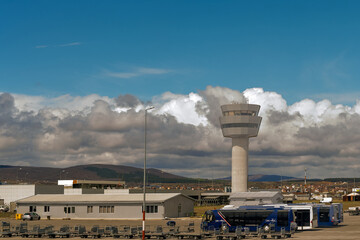 airport control tower at the airport Pristina international under heavy clouds