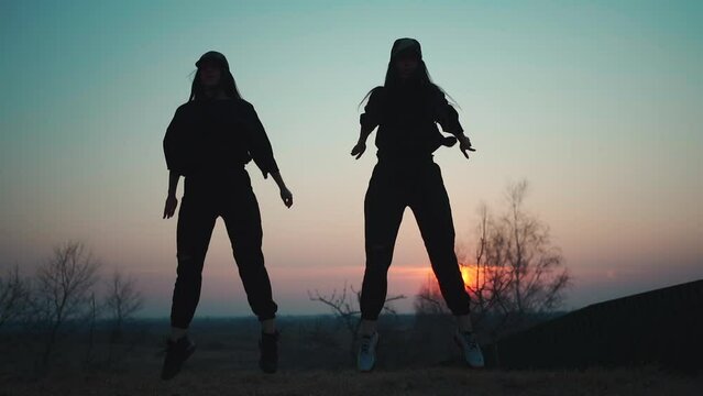 two female athlete have fitness workout and exercise on fresh open air at sunset