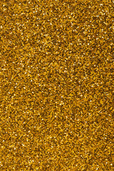 uniform background of golden color with songs gold, background with sparkles and glitters