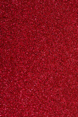 red shiny monochromatic background with sequins close-up