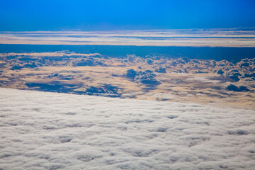 Beautiful aerial view above clouds with sunset. Airplane view, concept travel and Transportation,
