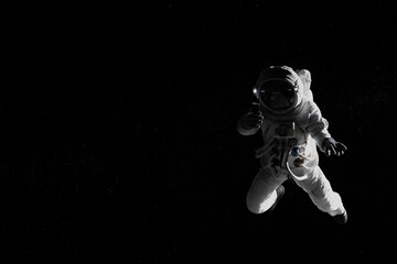 Caucasian female astronaut using her mobile phone during spacewalk, messaging, taking pictures - obrazy, fototapety, plakaty