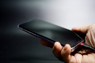 hand holding a phone