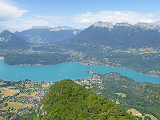 Fototapeta na wymiar Paragliding above Lake Annecy in the French Alps 