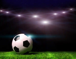 Fototapeta na wymiar Soccer ball on grass against black