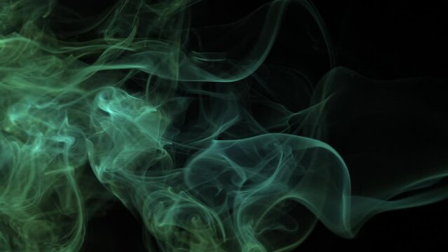 Abstract green smoke flowing smoothly horizontal, perfect for background or overlay. Plasma, mist, chemical effect. Abstract shapes. 4K clip